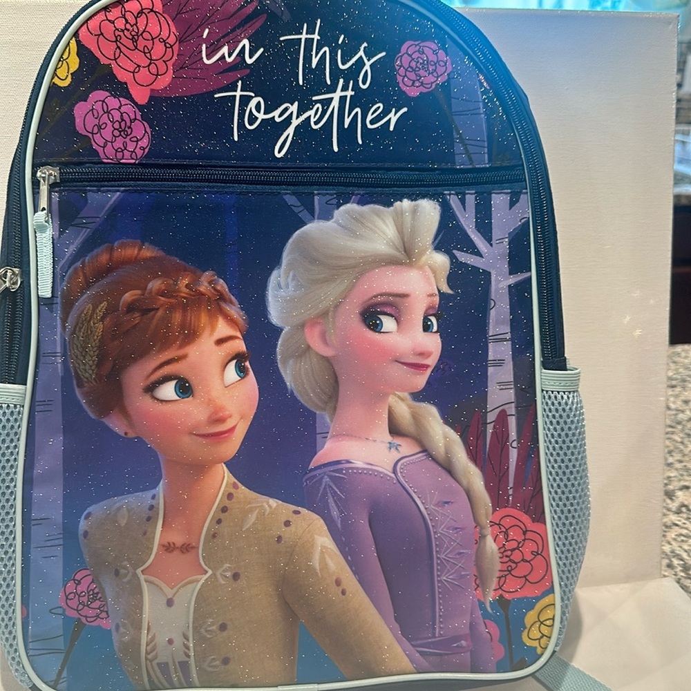 NWT Disney Frozen Backpack with mesh side pockets and zipper closure.